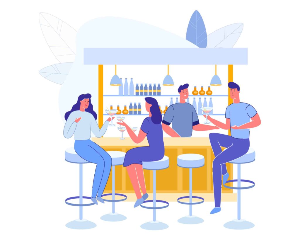 A group of people sitting at the bar