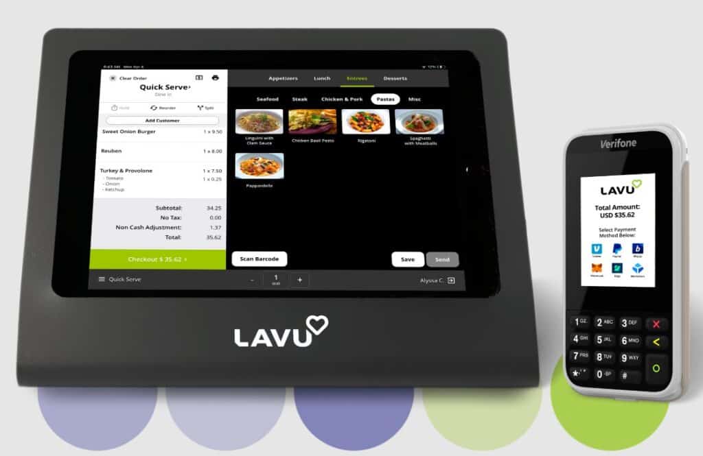 A tablet with a remote control sitting on top of it.